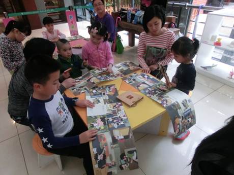 说明: C:\Users\LLM\Desktop\已调整\2017.4.22 越秀区图书馆开展“万花筒——认识图书馆”活动,图为读者制作“认识图书馆”绘本。.JPG